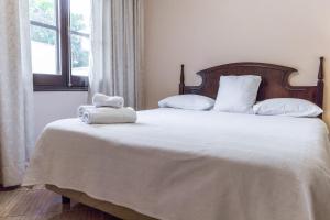 Paramanta Lifestyle Hotel tesisinde bir odada yatak veya yataklar