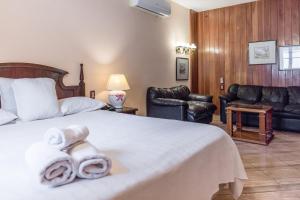 Paramanta Lifestyle Hotel tesisinde bir odada yatak veya yataklar