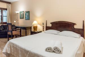 Paramanta Lifestyle Hotel tesisinde bir odada yatak veya yataklar