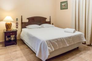 Paramanta Lifestyle Hotel tesisinde bir odada yatak veya yataklar