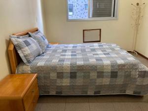 A bed or beds in a room at Joneson aluga um apto 3 Quartos na beira da Praia do Forte