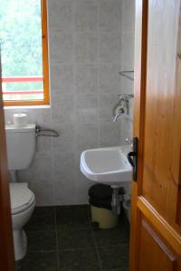 a bathroom with a toilet and a sink at Victoria Sinemorets Guest House in Sinemorets +39 photos