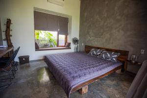 Ein Bett oder Betten in einem Zimmer der Unterkunft Cat Homestay