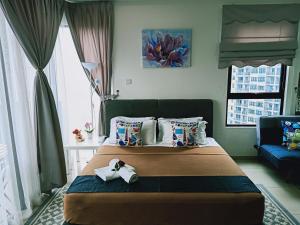 Postelja oz. postelje v sobi nastanitve D'Gunduls Homestay STUDIO by DGH I-CITY