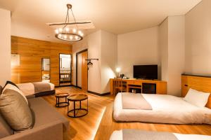 Postel nebo postele na pokoji v ubytování HOTEL KARUIZAWA CROSS