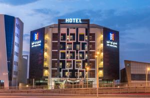 a hotel with a sign on the side of it at Art View Hotel - Riyadh Convention & Exhibition Center in Riyadh