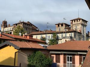 a group of buildings in a city with roofs at Appartamento Alice a Malpensa Aeroporto in Somma Lombardo
