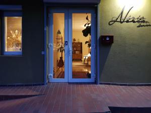 an open door of a store with a door at Nėris Inn Terraces in Vilnius