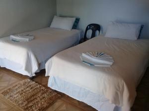 A bed or beds in a room at Ribaneng Lodge
