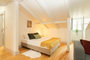 Ein Bett oder Betten in einem Zimmer der Unterkunft Cosy Baixa Studio