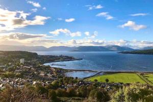 a view of a body of water with a town at The Warwick Apartment in Greenock
