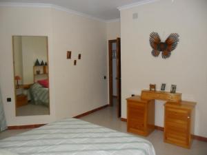 Łóżko lub łóżka w pokoju w obiekcie Casa Las Lomas