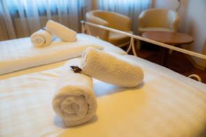 Postel nebo postele na pokoji v ubytování Hotel Ariston