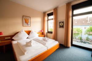 Postel nebo postele na pokoji v ubytování Hotel Ariston