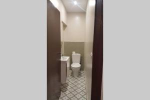 a bathroom with a white toilet in a room at Casa Mercedes. Laguardia (Alava) in Laguardia +10 photos