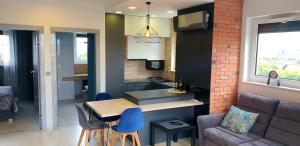 Posedenie v ubytovaní Luksusowy apartament z tarasem