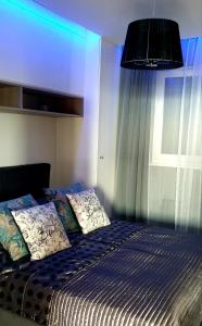 Posteľ alebo postele v izbe v ubytovaní Luksusowy apartament z tarasem