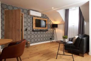 TV a/nebo společenská místnost v ubytování Coffee Fellows Hotel Trier