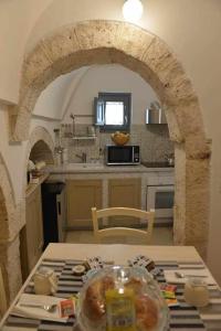 A kitchen or kitchenette at Trulli Live Alberobello