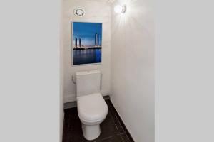 a bathroom with a white toilet in a room at Logement de charme - Saint Pierre - Cœur historique Bordeaux in Bordeaux