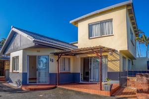 a house with a front entrance with a porch at 15 @ Porter Guesthouse in Port Shepstone