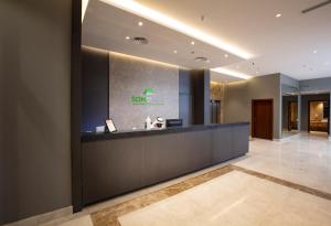 a lobby of a hotel with a reception desk at SOMEDAYS Hotel Suites in Al Hofuf