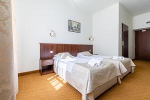 Postel nebo postele na pokoji v ubytování Kamienica Szefferów 1848 r.
