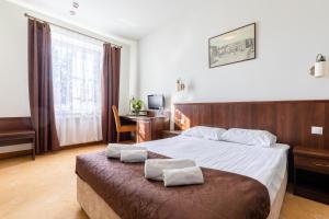 Posteľ alebo postele v izbe v ubytovaní Kamienica Szefferów 1848 r. + 37 fotografií