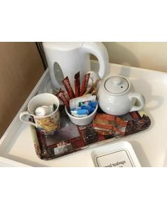 a shelf with a tea pot and other items on it at 31 Queens Road in Winchester