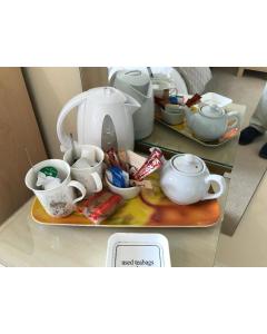 a tray with tea pots and cups on a table at 31 Queens Road in Winchester