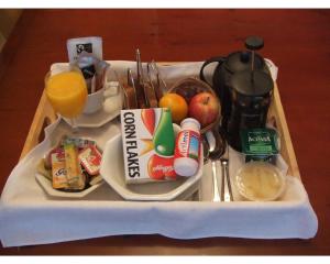 a tray with breakfast foods and drinks on it at 31 Queens Road in Winchester