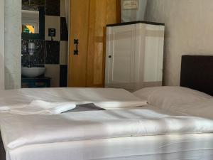 Posteľ alebo postele v izbe v ubytovaní Penzión Turista