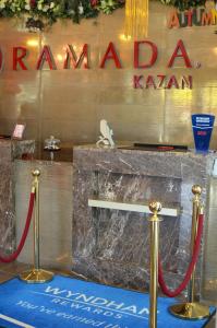 a sign for a barber shop in front of a barber shop at Ramada by Wyndham Kazan City Centre in Kazan