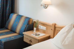Łóżko lub łóżka w pokoju w obiekcie Park Hotel Villa Etschland