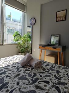 Postel nebo postele na pokoji v ubytování Ermou 18 Mosaics boutique apartment