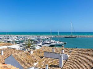 a view of a harbor with boats in the water at VACATION MARBELLA I Stylish 5BDR Penthouse, Sea and Marina View in Marbella