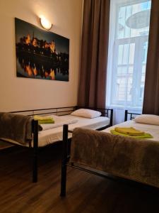 Posteľ alebo postele v izbe v ubytovaní Amber Hostel