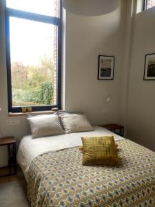 Postel nebo postele na pokoji v ubytování B&B De Woestijn