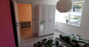 Postel nebo postele na pokoji v ubytování Ferienwohnung Am Gondelteich
