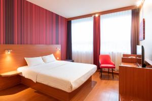 Postel nebo postele na pokoji v ubytování Star G Hotel München Schwabing