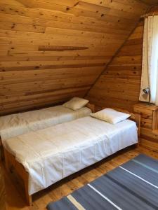 Letto o letti in una camera di Meelste puhkemajad Tahkunas- Sõnn ja Lõvi