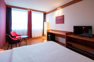 Postel nebo postele na pokoji v ubytování Star G Hotel München Schwabing