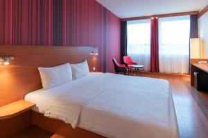 Postel nebo postele na pokoji v ubytování Star G Hotel München Schwabing