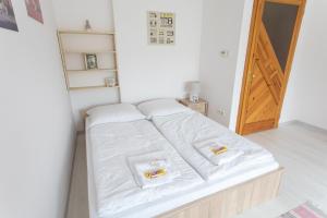 Posteľ alebo postele v izbe v ubytovaní AIDA Sport Apartman