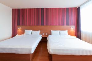 Postel nebo postele na pokoji v ubytování Star G Hotel München Schwabing