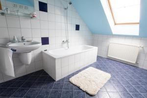 Kúpeľňa v ubytovaní AIDA Sport Apartman