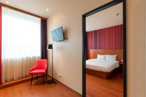 Postel nebo postele na pokoji v ubytování Star G Hotel München Schwabing
