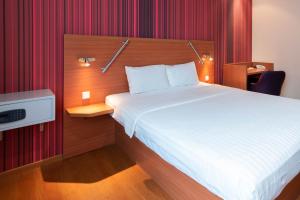 Postel nebo postele na pokoji v ubytování Star G Hotel München Schwabing