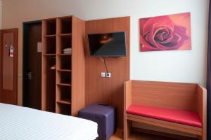 Postel nebo postele na pokoji v ubytování Star G Hotel München Schwabing