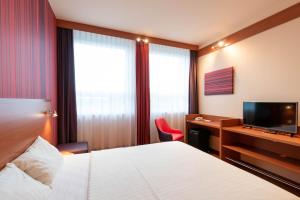 Postel nebo postele na pokoji v ubytování Star G Hotel München Schwabing